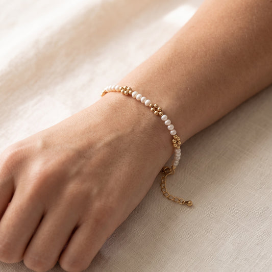 Pearl and Gold Clasp DNA Profile Bracelet, worn