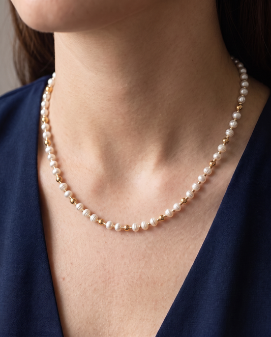 Pearl and Gold Pattern DNA Profile Necklace worn on the neck