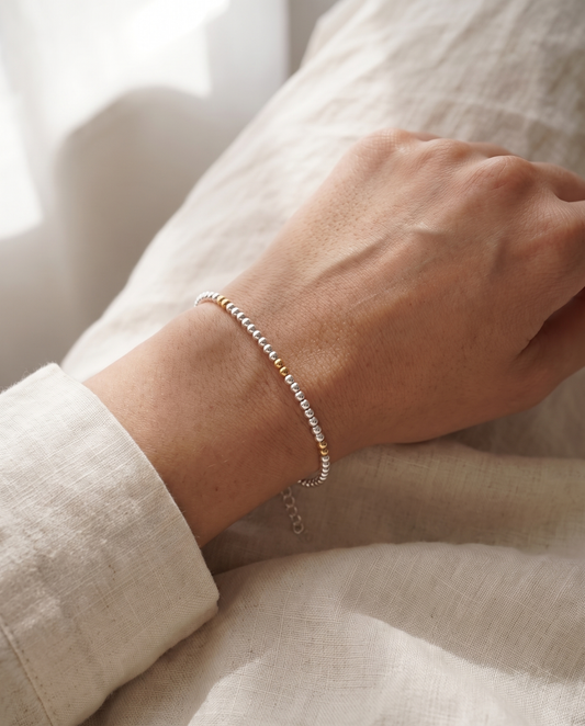 Silver and Gold Clasp Bracelet worn on the wrist