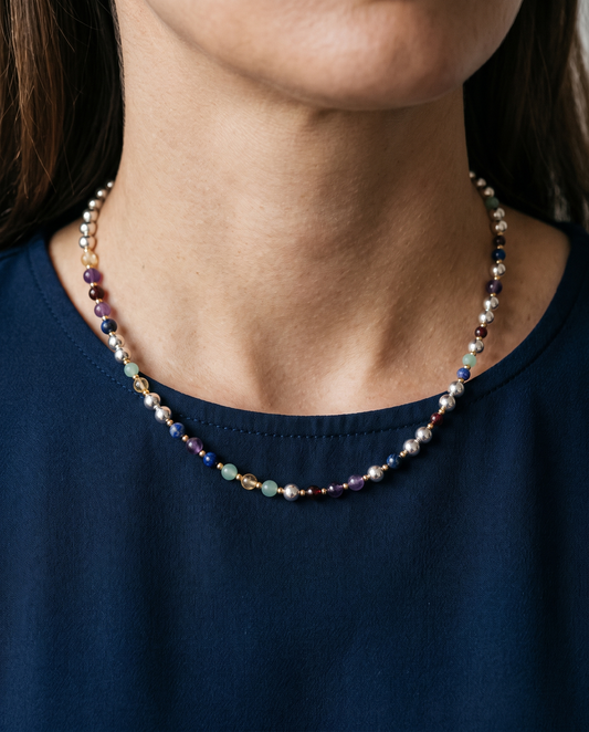 Silver Bead Gold Accent DNA Necklace worn on the neck