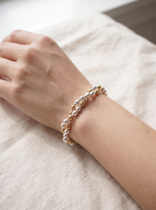 Twisted Silver and Gold Bracelet worn on the wrist