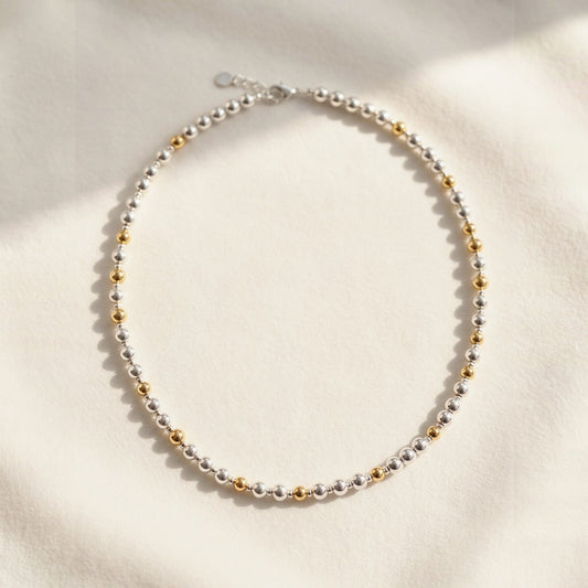 Pattern DNA necklace: the Silver and Gold Pattern DNA Profile Necklace laid flat