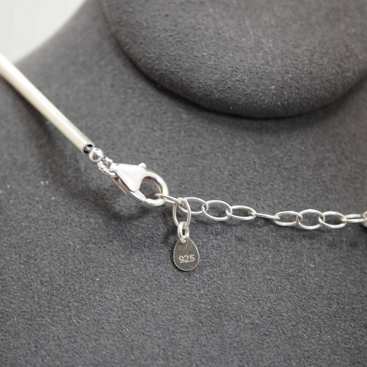 Penta D marker as the amethyst stone at the clasp end of a Silver Sphere DNA Profile Necklace