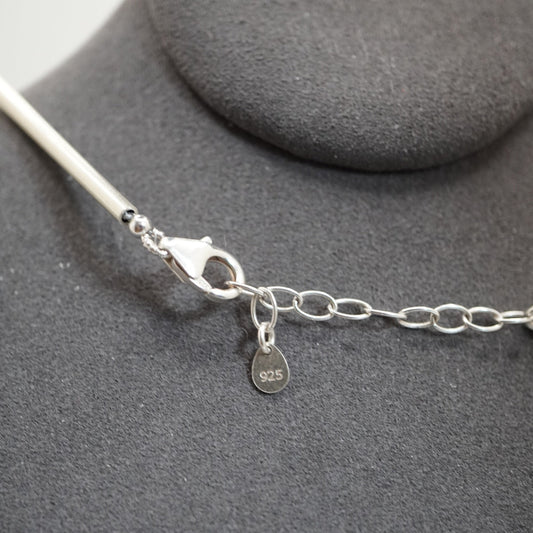 Penta D marker as the amethyst stone at the clasp end of a Silver Sphere DNA Profile Necklace