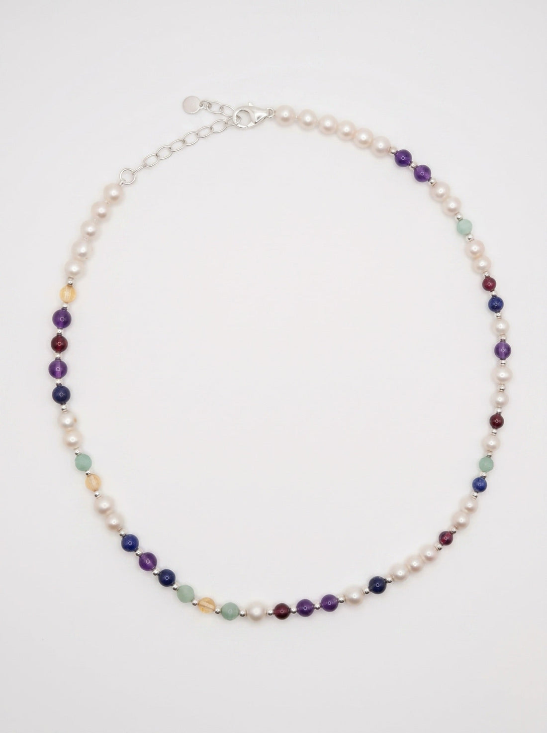DesigNA pearl DNA necklace worn at the collarbone