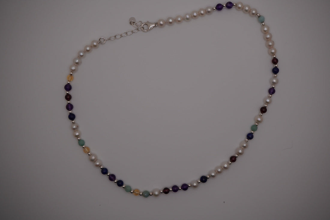 Silver DNA Profile Necklace laid flat, showing the marker pattern