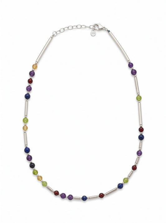 DNA necklace care guide showing silver, gold and pearl DesigNA necklaces laid out for cleaning