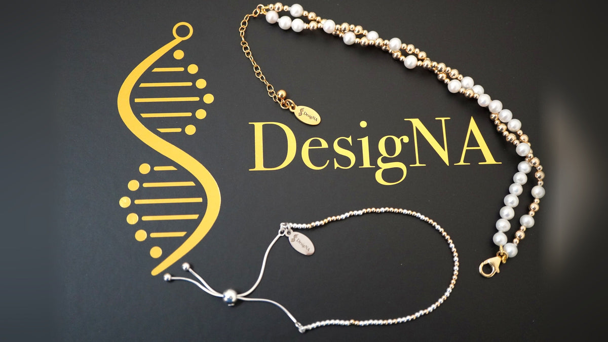 Three DesigNA bracelets on the gold logo box