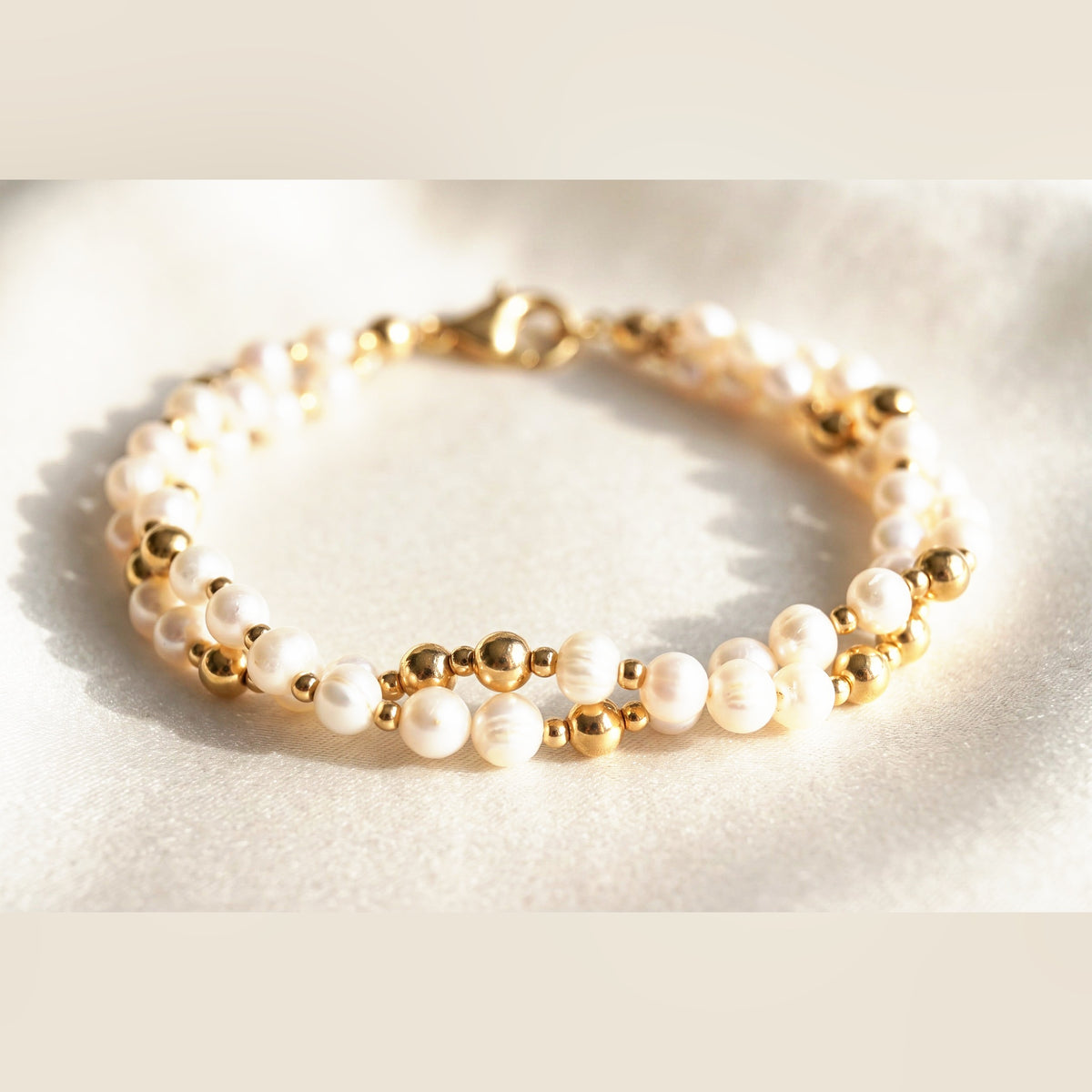 Twisted Pearl and Gold DNA Profile Bracelet, flat lay