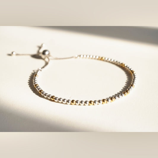 Spider Silver and Gold DNA Profile Bracelet, flat lay