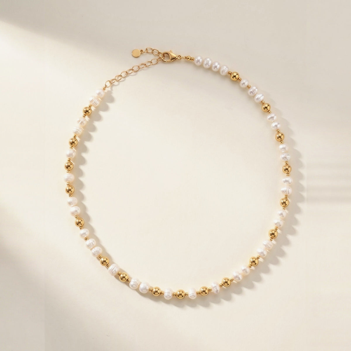 Pearl and Gold Pattern DNA Profile Necklace, flat lay