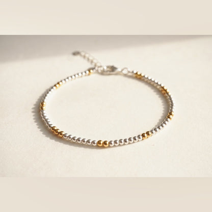 Silver and Gold Clasp DNA Profile Bracelet, flat lay
