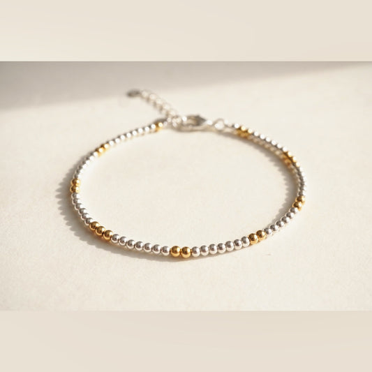 Silver and Gold Clasp DNA Profile Bracelet, flat lay