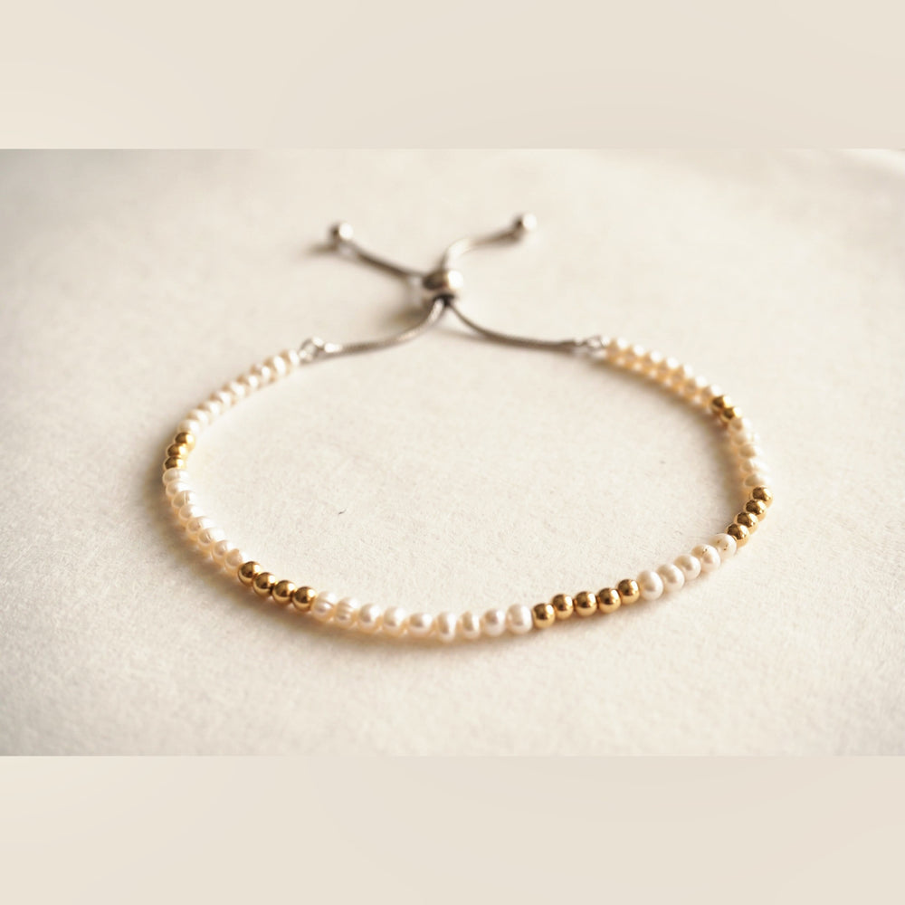Spider Pearl and Gold DNA Profile Bracelet, flat lay