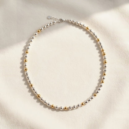 Silver and Gold Pattern DNA Profile Necklace, flat lay