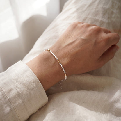 Silver and Gold Clasp DNA Profile Bracelet, worn