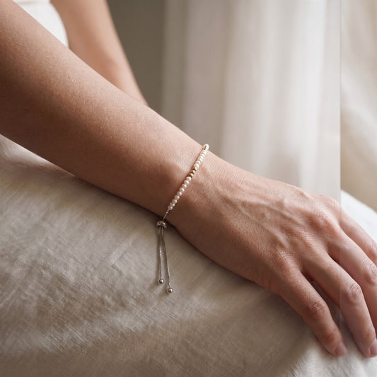 Spider Pearl and Gold DNA Profile Bracelet, worn