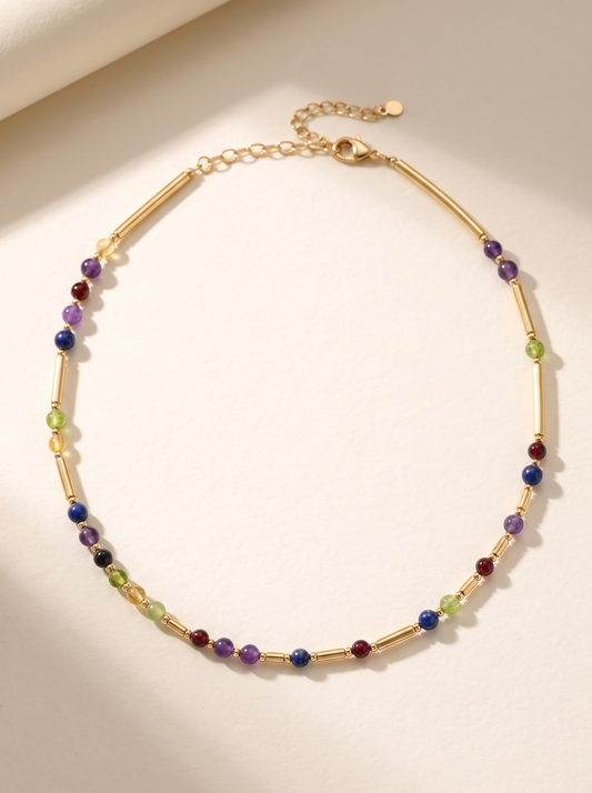 Gold DNA Profile Necklace, gemstone markers set between 9ct gold batons in the order the DNA places them