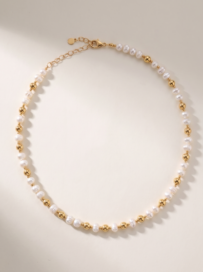 Pearl and Gold Pattern DNA Profile Necklace laid flat, freshwater pearls with gold spheres marking the DNA positions