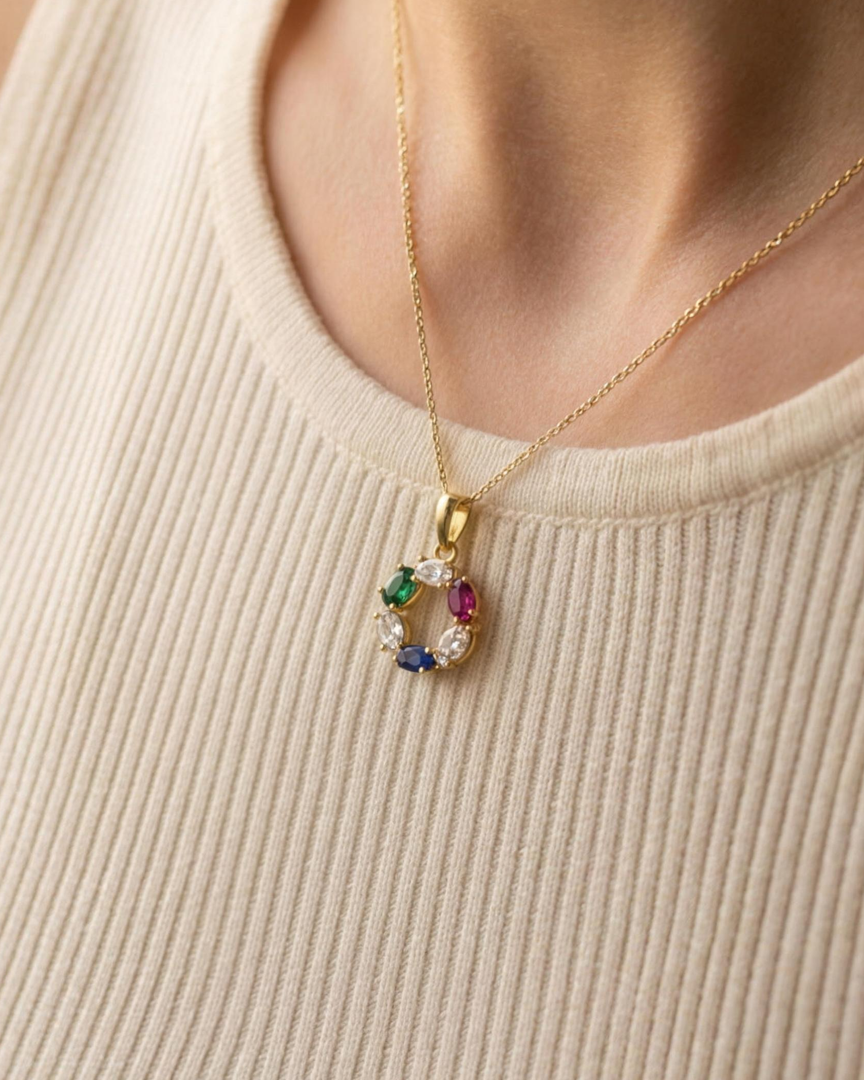 The DNA Representation Pendant worn, seen from a three quarter angle