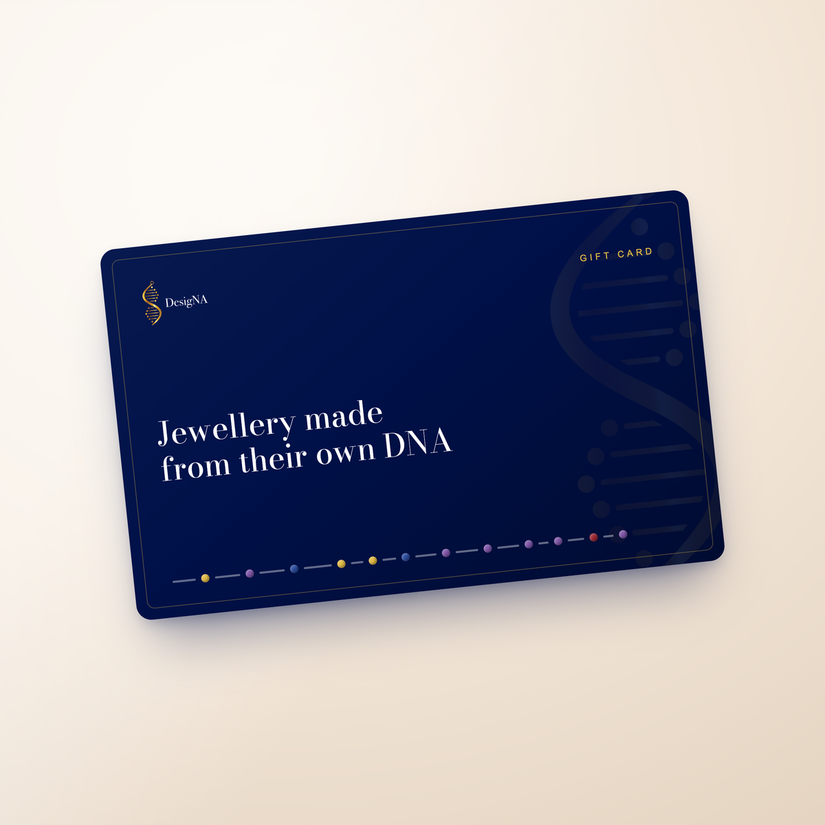 A navy and gold DesigNA gift card, with the stone markers of a DNA profile running along its lower edge