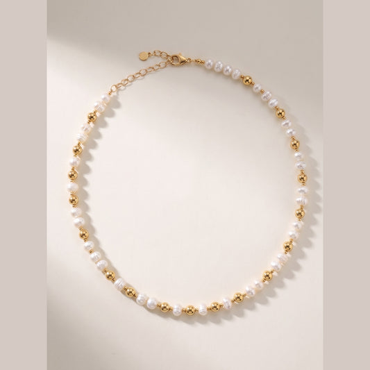 Pearl and Gold Pattern DNA Profile Necklace laid flat, freshwater pearls with gold spheres marking the DNA positions