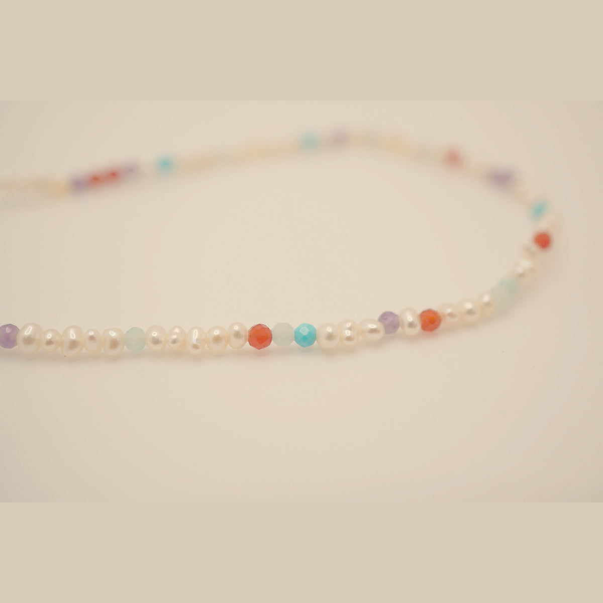 Macro of the Pearl Clasp DNA Profile Bracelet freshwater pearls and gemstone markers