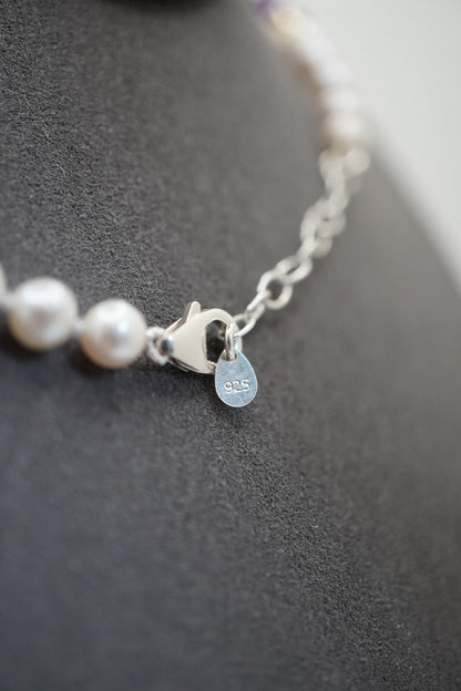 Close up of the pearl necklace clasp, extender chain and stamped 925 disc