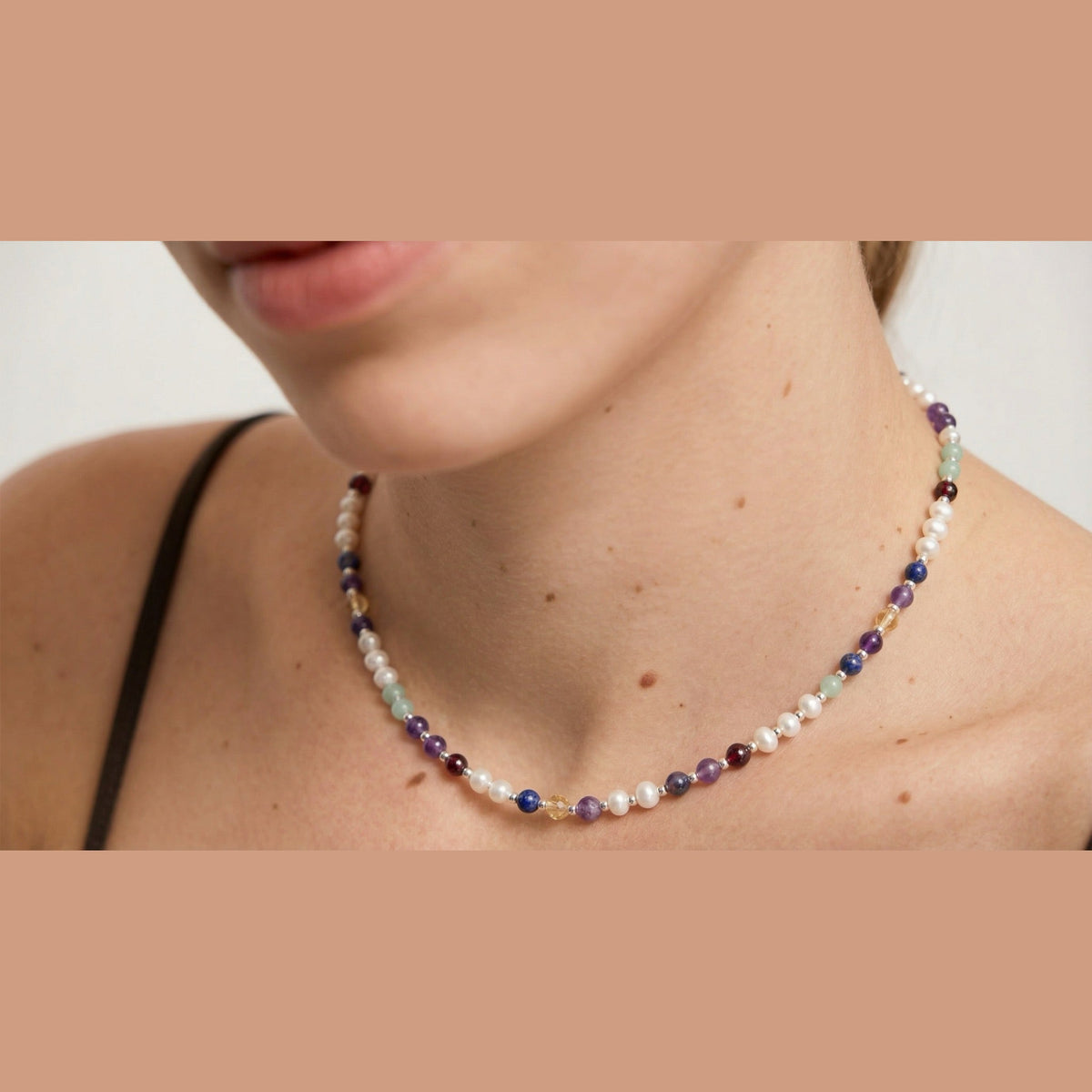 Pearl DNA Profile Necklace worn on the neck, close crop with no face shown