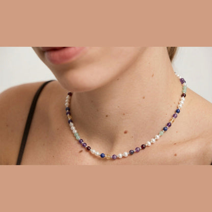 Pearl DNA Profile Necklace worn on the neck, close crop with no face shown