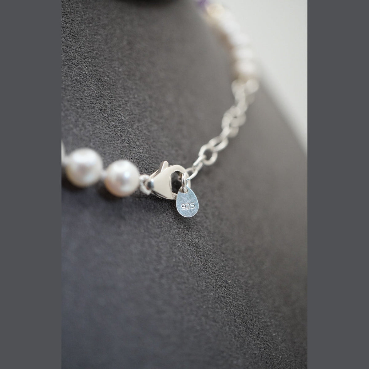 Close up of the pearl necklace clasp, extender chain and stamped 925 disc