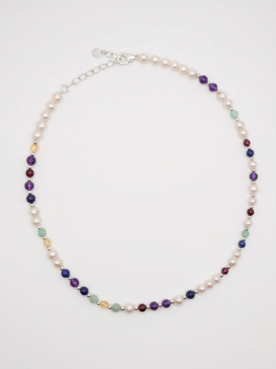 Pearl DNA Profile Necklace laid flat in an oval loop on a soft white background