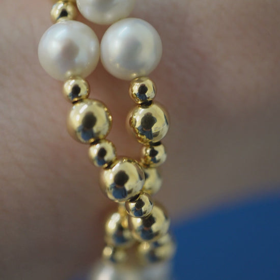 Twisted Pearl and Gold bracelet on the wrist, macro pulling back to the whole piece