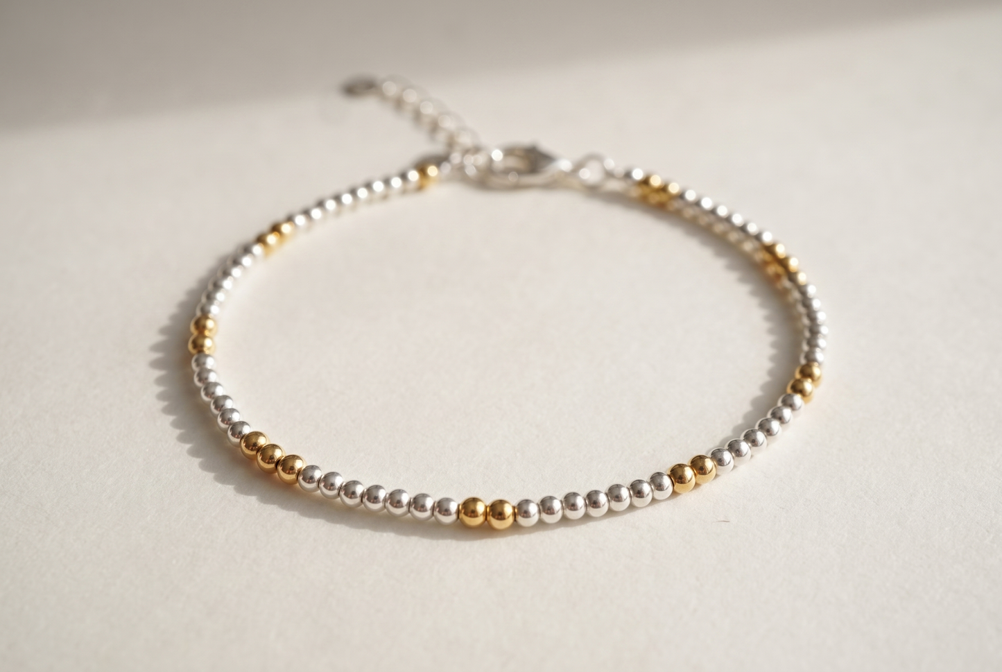 Silver and Gold Clasp Bracelet with silver beads and gold marker beads