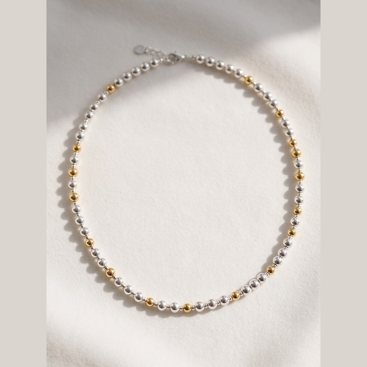 Silver and Gold Pattern DNA Profile Necklace with silver spheres and gold markers