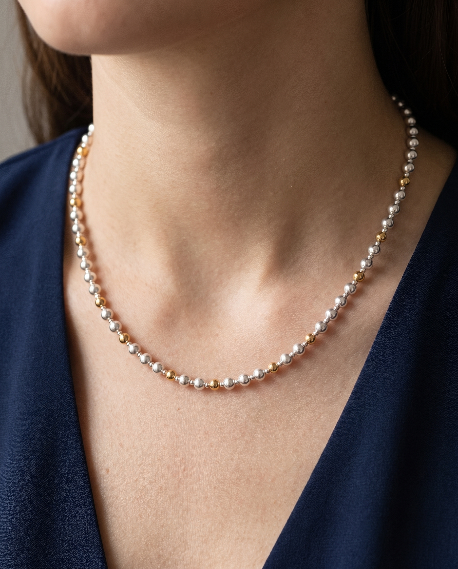 Silver and Gold Pattern DNA Necklace worn on the neck