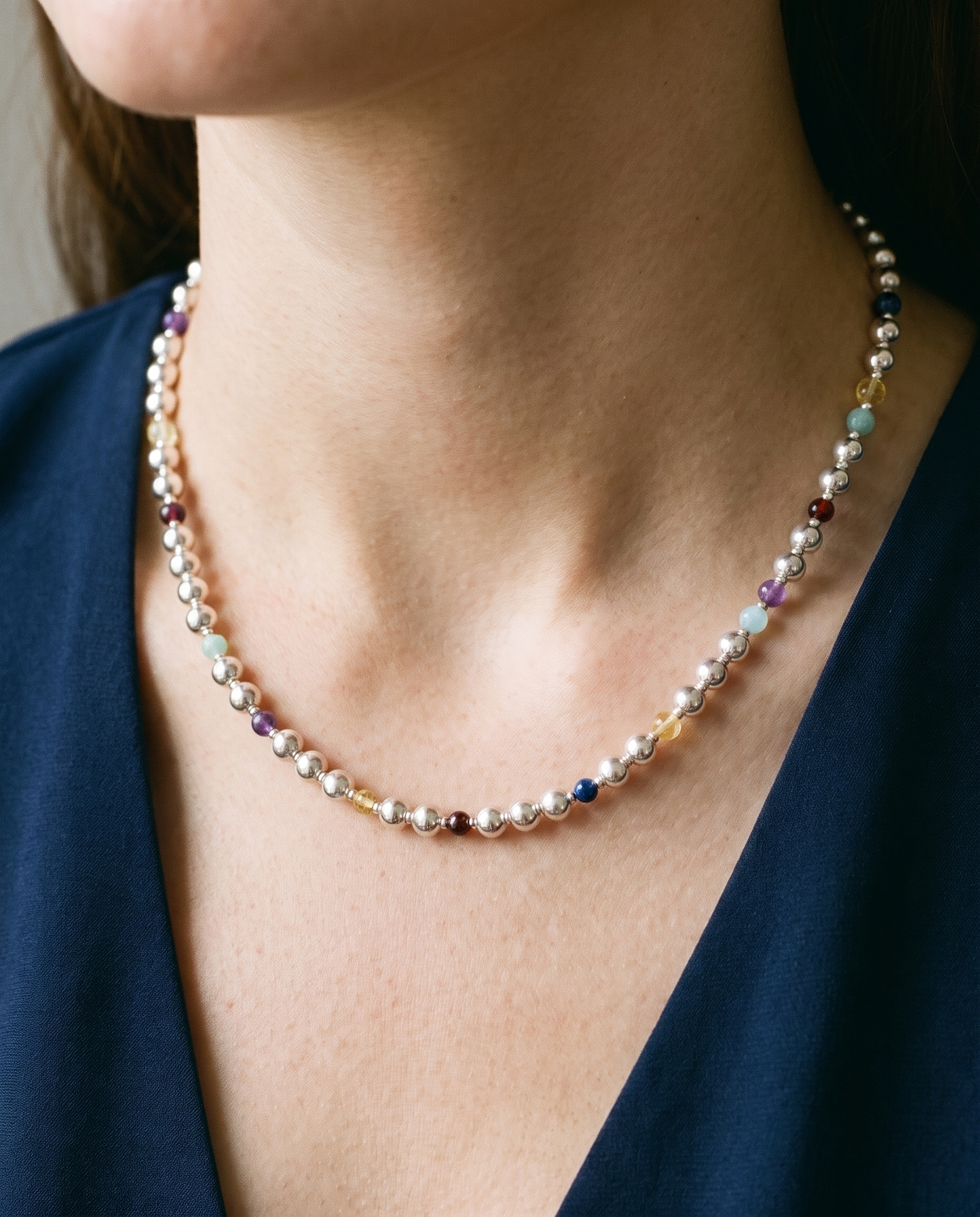 Silver Sphere DNA Profile Necklace worn on the neck