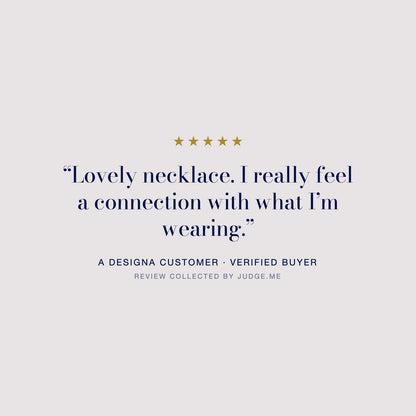 Five star customer review of the Silver Sphere Gold Accent DNA Profile Necklace: “Lovely necklace. I really feel a connection with what I’m wearing.” A DesigNA customer, review collected by Judge.me.