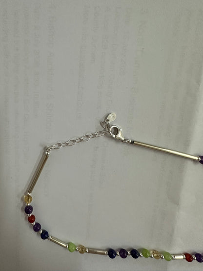 Close up of the silver necklace clasp, extender chain and stamped 925 disc