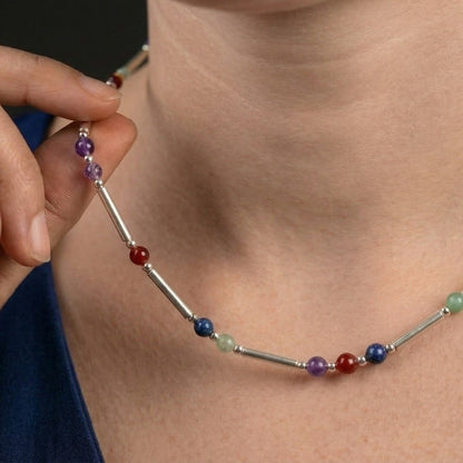 Silver DNA Profile Necklace worn on the neck, close crop with no face shown