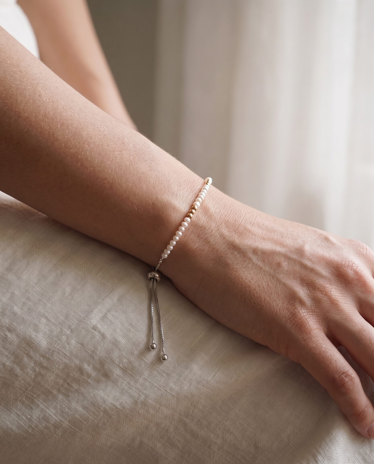 Spider Pearl and Gold Bracelet worn on the wrist