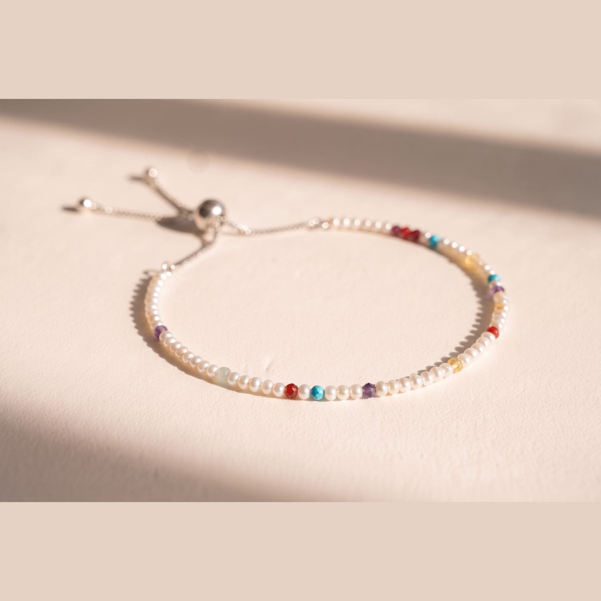 Spider Pearl DNA Profile Bracelet, fine freshwater pearls with gemstone markers on an adjustable slider
