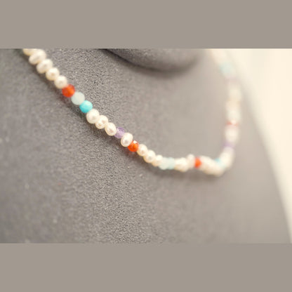 Macro of the Spider Pearl Clasp DNA Profile Bracelet showing 2mm pearls and faceted gemstone markers