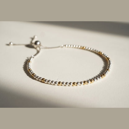 Spider Silver and Gold DNA Profile Bracelet with silver spheres and gold markers, adjustable slider clasp