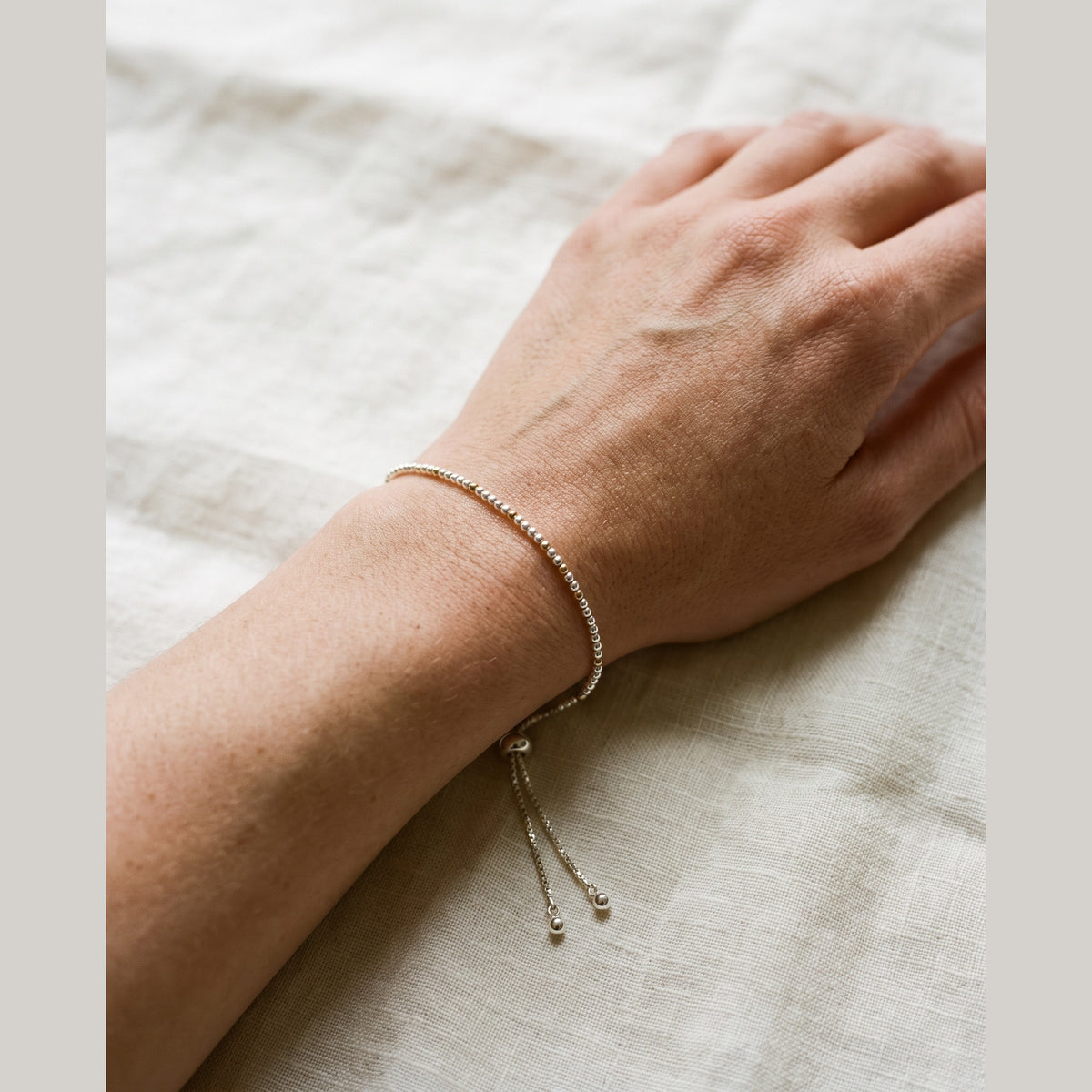 Spider Silver and Gold DNA Profile Bracelet worn on the wrist