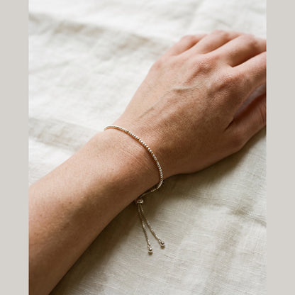 Spider Silver and Gold DNA Profile Bracelet worn on the wrist