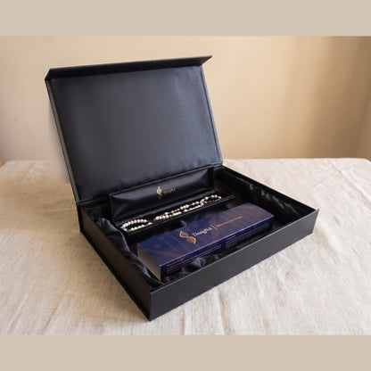 Your second delivery: the finished piece presented in the open DesigNA box with the navy sleeve