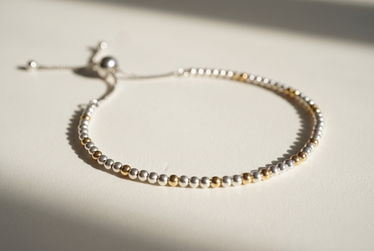 Spider Silver and Gold Bracelet with silver beads and gold marker beads, adjustable slider clasp