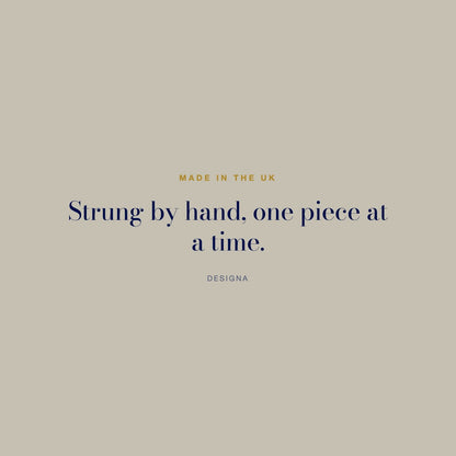 DesigNA card. Made in the UK: Strung by hand, one piece at a time.