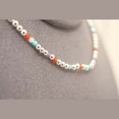 Macro of the Spider Silver Clasp DNA Profile Bracelet showing the 2mm silver spheres and gemstone markers